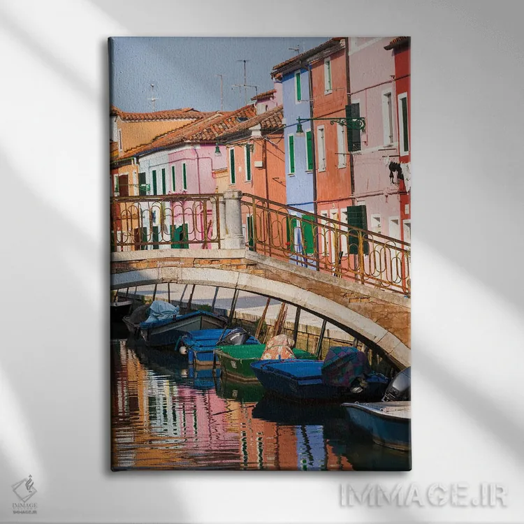 تابلو دکوراتیو Burano. Reflection of colorful houses in canal.,ایتالیا، بو… اثر مریل ایماجز - نمای روبهرو روی دیوار
