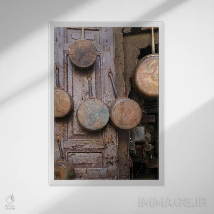 تابلو دکوراتیو Morocco. Antique Copper Pans For Sale In The Medina,فاس… اثر ژولین مک رابرتس - نمای قابدار سفید