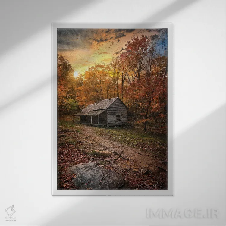 تابلو دکوراتیو غروب نزدیک کلبه چوبی اثر عکاسی جاناتان راس - نمای قابدار سفید