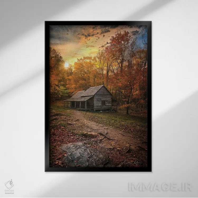 تابلو دکوراتیو غروب نزدیک کلبه چوبی اثر عکاسی جاناتان راس - نمای قابدار مشکی