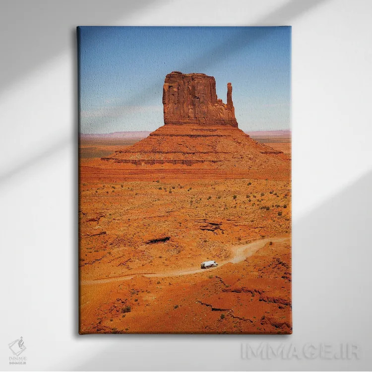 تابلو دکوراتیو Monument Valley,تپه با کامیون، دره یادبود اثر جین ریکس - نمای روبهرو روی دیوار