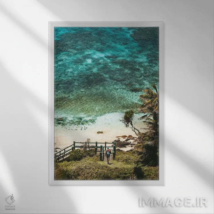 تابلو دکوراتیو قدم زن در ساحل بکر و دنج اثر جیمز وودیکا - نمای قابدار سفید