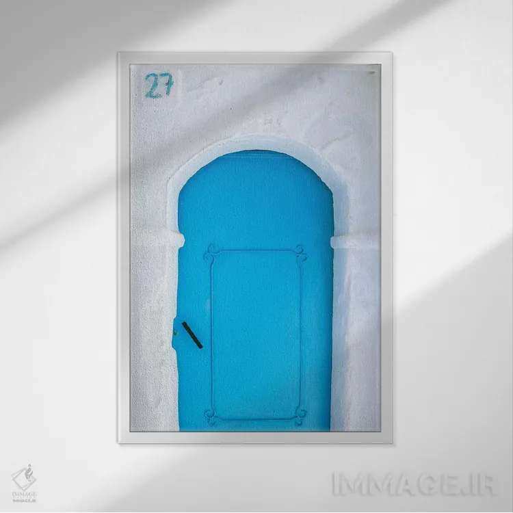 تابلو دکوراتیو Morocco, Chefchaouen. Blue door in white building.,آفریقا، م… اثر جینز گالری - نمای قابدار سفید