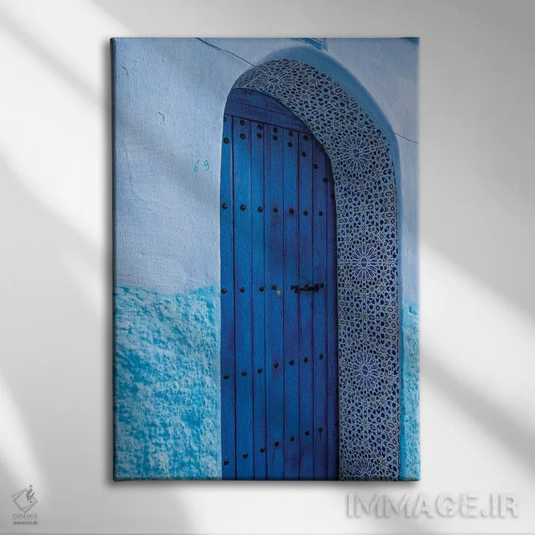 تابلو دکوراتیو Morocco, Chefchaouen. Arch Over Wooden Door.,آفریقا، مراکش… اثر جینز گالری - نمای روبهرو روی دیوار