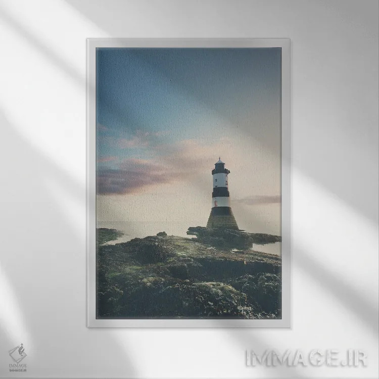 تابلو دکوراتیو فانوس دریایی پنروز هنگام طلوع آفتاب اثر لورا ایوانز - نمای قابدار سفید