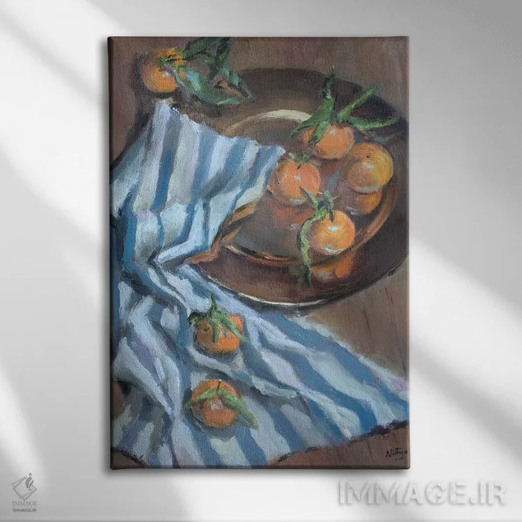 تابلو دکوراتیو پرتقال ها و پارچه اثر نیتیا سوامیناتان - نمای روبهرو روی دیوار
