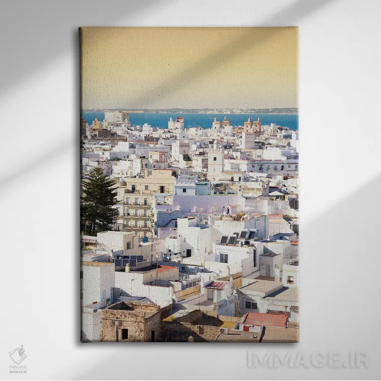 تابلو دکوراتیو "شهر سفید کادیز در غروب" اثر فیلیپ هوگونار - نمای روبهرو روی دیوار