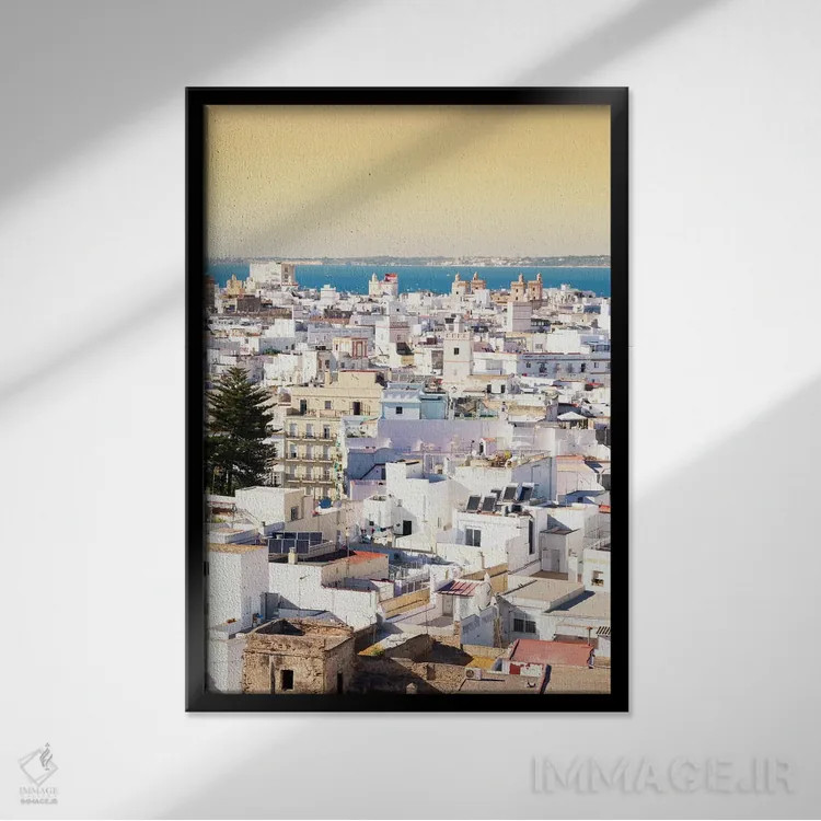 تابلو دکوراتیو "شهر سفید کادیز در غروب" اثر فیلیپ هوگونار - نمای قابدار مشکی