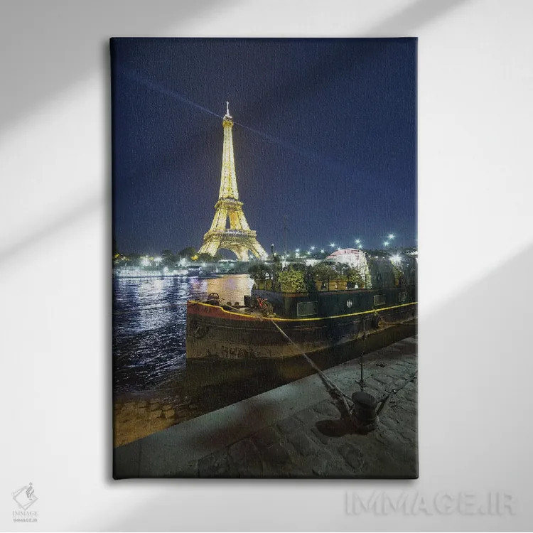 تابلو دکوراتیو برج ایفل در پاریس و کانال سن در شب اثر فیلیپ منگوئن - نمای روبهرو روی دیوار
