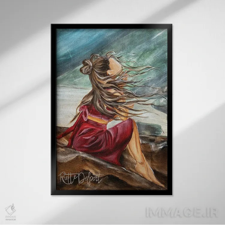 تابلو دکوراتیو دختر با لباس قرمز نشسته روی صخره ها اثر روت آرت کرییشنز - نمای قابدار مشکی