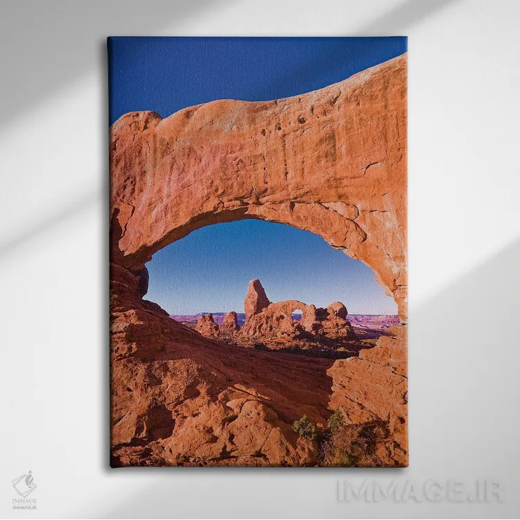تابلو دکوراتیو Arches National Park, Utah, USA,نور صبحگاهی بر طاقک برجکی از… اثر راس بیشاپ - نمای روبهرو روی دیوار