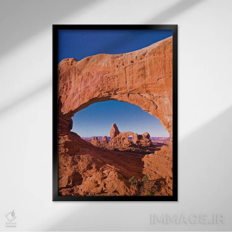 تابلو دکوراتیو Arches National Park, Utah, USA,نور صبحگاهی بر طاقک برجکی از… اثر راس بیشاپ - نمای قابدار مشکی