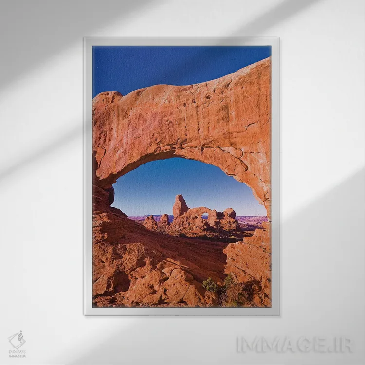 تابلو دکوراتیو Arches National Park, Utah, USA,نور صبحگاهی بر طاقک برجکی از… اثر راس بیشاپ - نمای قابدار سفید