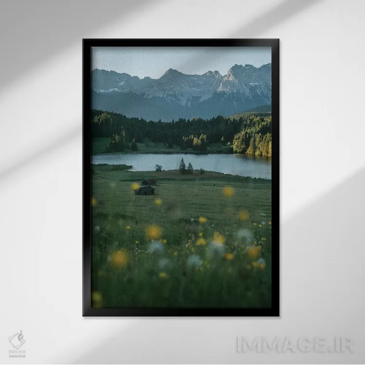 تابلو دکوراتیو مرغزار دریاچه کوهستانی آرام هنگام طلوع خورشید اثر مایکل شاور - نمای قابدار مشکی