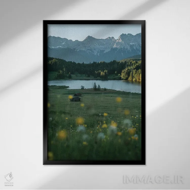 تابلو دکوراتیو مرغزار دریاچه کوهستانی آرام هنگام طلوع خورشید اثر مایکل شاور - نمای قابدار مشکی