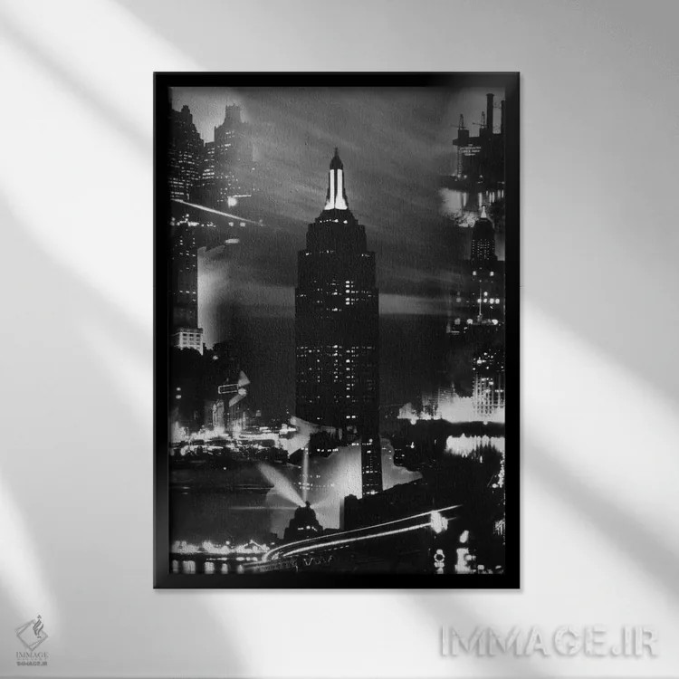 تابلو دکوراتیو مونتاژ ساختمان های نیویورک در شب با ساختمان امپایر استیت د… اثر تصاویر وینتج - نمای قابدار مشکی