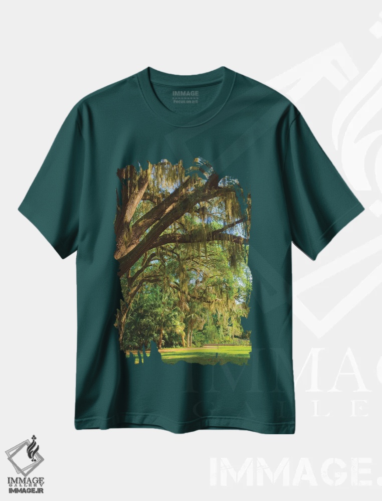 تیشرت سبز طرح دار Florida. Tropical garden with palm trees and living oak covered in Spanish moss.,ایالات متحده، فلوریدا. باغ گرمسیری با نخل و بلوط زنده پوشیده از خزه اسپانیایی اثر آنا میلر