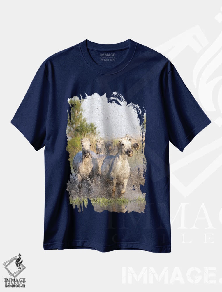 تیشرت سرمه ای طرح دار Provence-Alpes-Cote D'Azur, France. Horses Running Through The Marshes In The Camargue.,سنت-ماری-دو-لامر، پروانس-آلپ-کوت دازور، فرانسه. اسب ها در حال دویدن در باتلاق های کامارگ. اثر امیلی ام ویلسون
