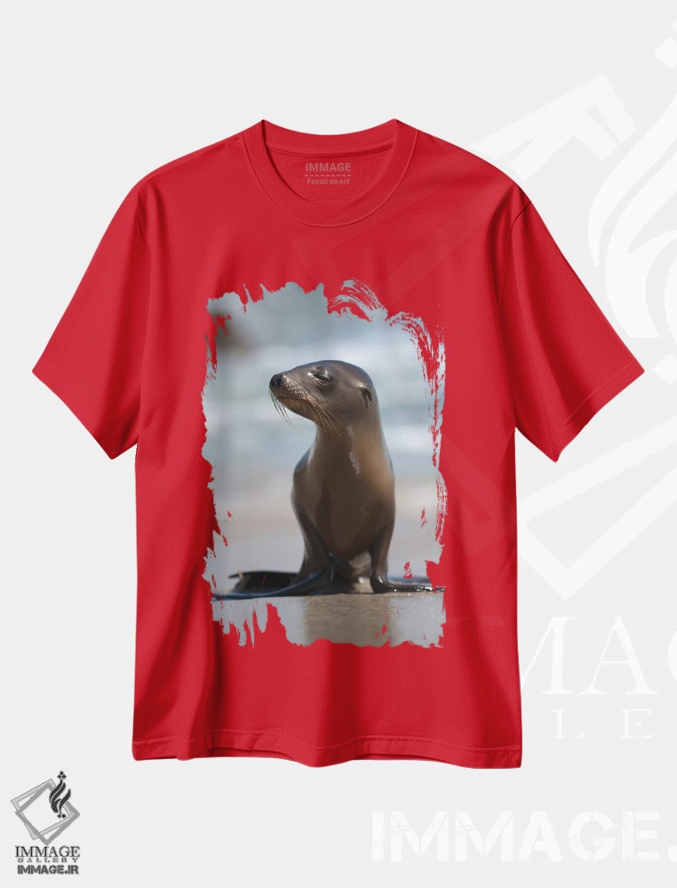تیشرت قرمز طرح دار California, La Jolla. Baby sea lion on beach.,آمریکا، کالیفرنیا، لا خوییا. توله شیر دریایی روی ساحل اثر جینز گالری
