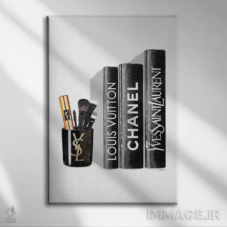 تابلو دکوراتیو کتاب ها با شمع YSL و براش ها اثر آماندا گرینوود - نمای روبهرو روی دیوار