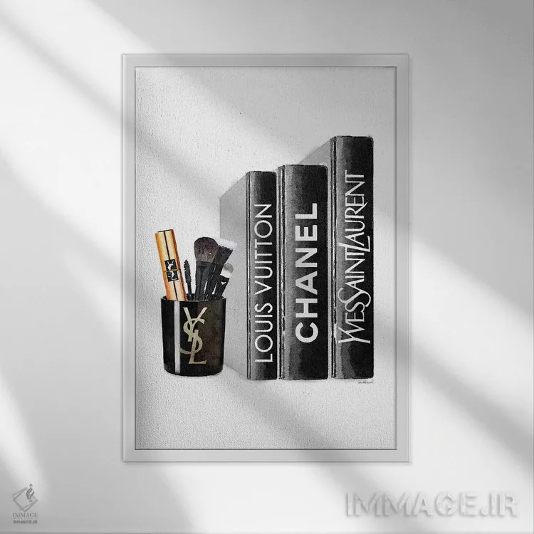 تابلو دکوراتیو کتاب ها با شمع YSL و براش ها اثر آماندا گرینوود - نمای قابدار سفید