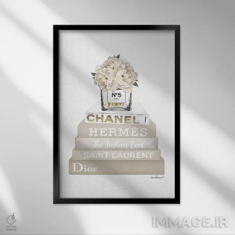 تابلو دکوراتیو Champagne, And Gold Bookstack Topped By Vase With White… اثر آماندا گرینوود - نمای قابدار مشکی