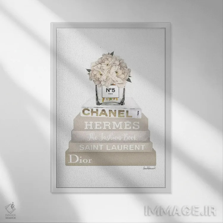 تابلو دکوراتیو Champagne, And Gold Bookstack Topped By Vase With White… اثر آماندا گرینوود - نمای قابدار سفید
