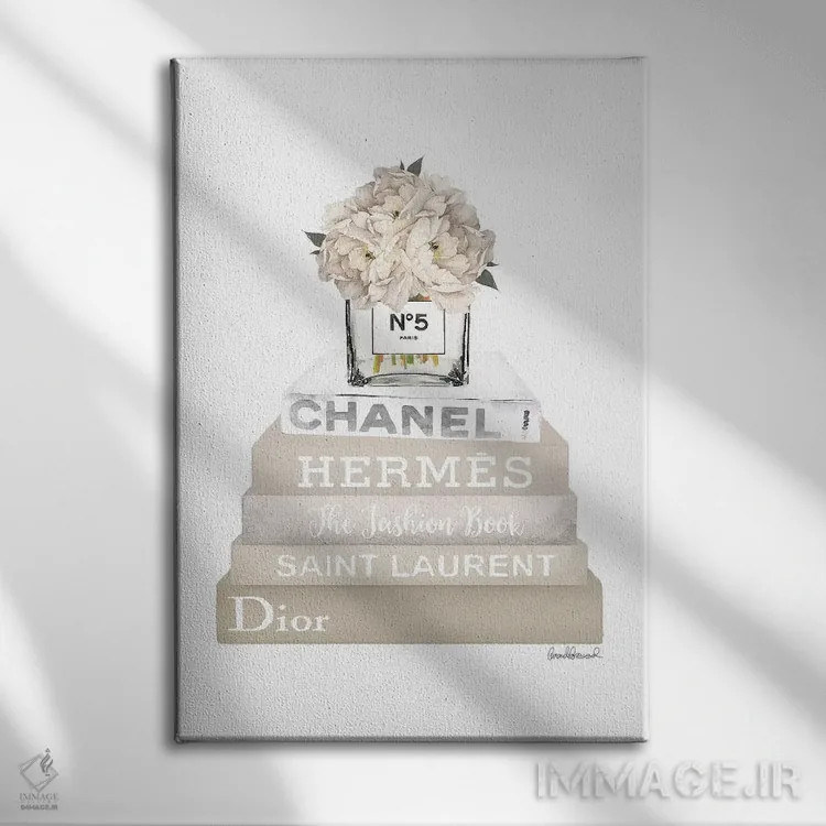 تابلو دکوراتیو Champagne, And Silver Bookstack Topped By Vase With Whit… اثر آماندا گرینوود - نمای روبهرو روی دیوار