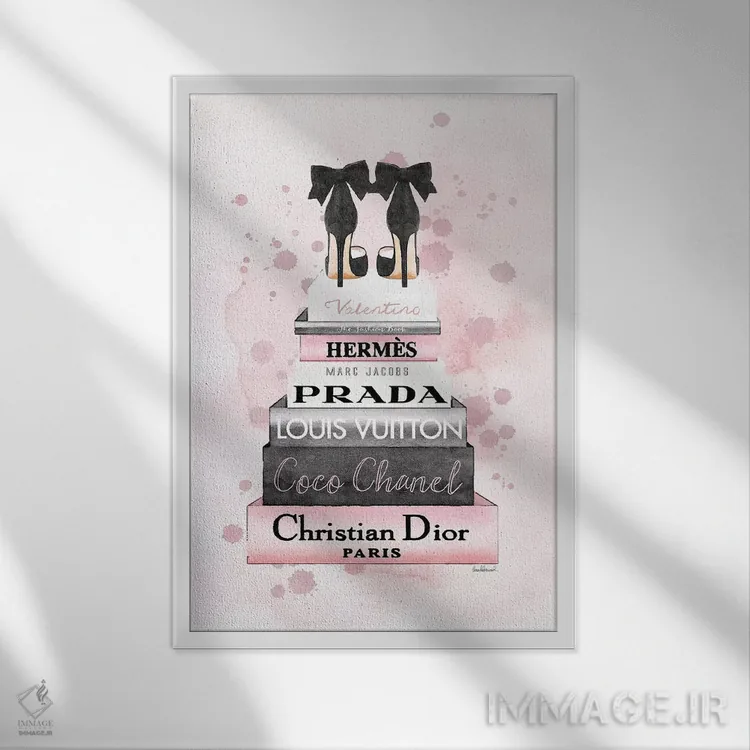 تابلو دکوراتیو دسته کتاب آبرنگی صورتی و خاکستری با پاشش رنگ اثر آماندا گرینوود - نمای قابدار سفید